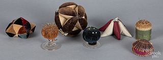Seven sewing pincushions, ca. 1900