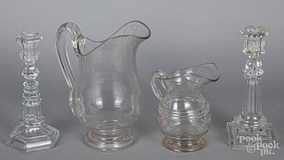 Two colorless glass pitchers
