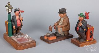 Three carved and painted hobo figures