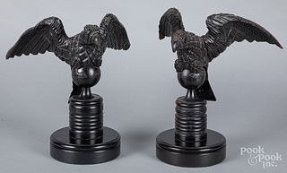 Carved and ebonized eagle, together with another
