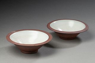Two Brown Ceramic Bowls by Peter Sabin.