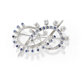 A 18K white gold, sapphire and diamond brooch