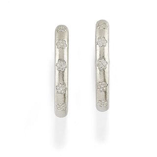A 18K satin white gold and diamond earrings
