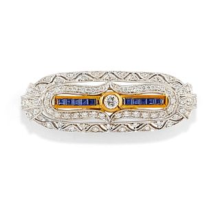 A 18K two-color gold, diamond and sapphire brooch
