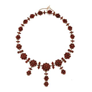 A silver and red garnet necklace
