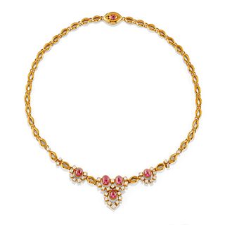 A 18K yellow gold, ruby and diamond demi parure