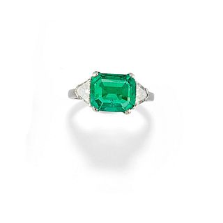 A platinum and emerald ring