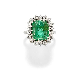 A 18K white gold, emerald and diamond ring