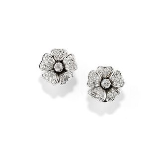 A 18K white gold and diamond earclips, defects