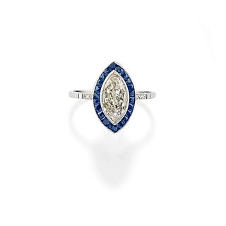 A platinum, sapphire and diamond ring