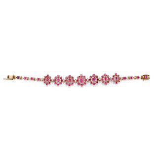 A low-carat gold, pink sapphire and uncolored gemstone bracelet, with certificate