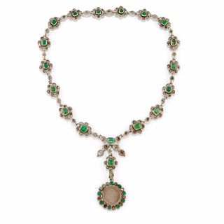 A silver, emerald and diamond necklace with pendant