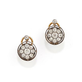 A silver, 18K yellow gold and diamond earrings
