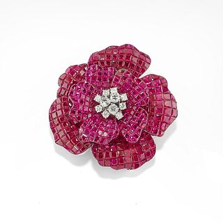 A 18K white gold, ruby and diamond brooch, defects