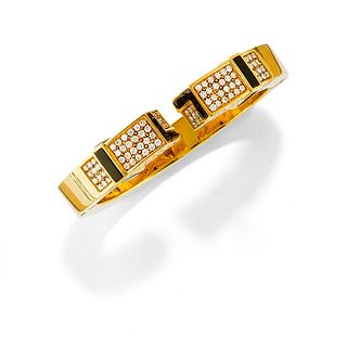 Chaumet - A 18K yellow gold and diamond bangle, Chaumet