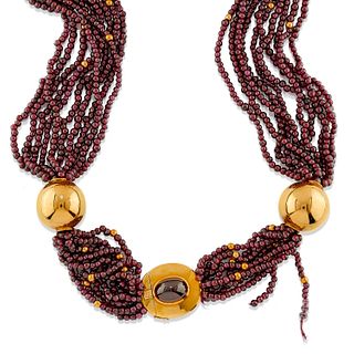 A 18K yellow gold and garnet necklace
