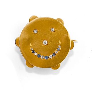 A 18K yellow gold, diamond and sapphire brooch