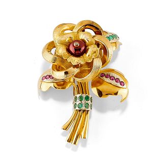 A 18K two-color gold, diamond, emerald, garnet and ruby brooch