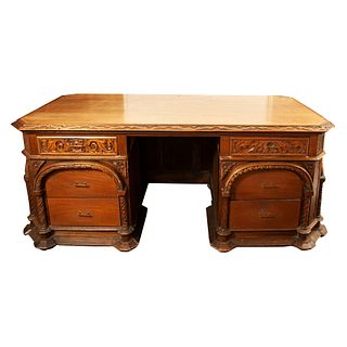 Desk. 20th century. Carved in wood. With rectangular top, 6 drawers with brass handles, bun-style supports.