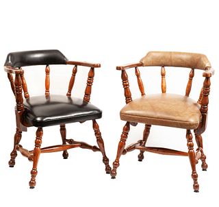 Pair of armchairs. 20th century. Carved in wood. With semi-open backrests and black and beige vinyl leather seats.