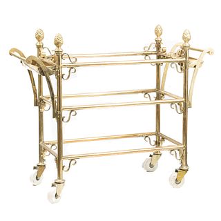 Service cart. 20th century. Arturo Pani Style. Golden brass. Three levels. With tubular structure. Decorated with rolls.