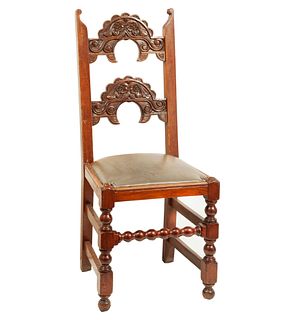 Chair. 20th century. Carved in wood. With semi-open backrest and brown leather seat.