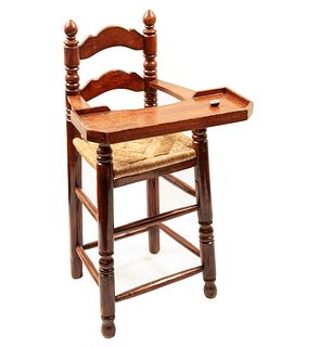 High chair. 20th century. Carved in wood. With woven palm seat. 37.4 x 19.6 x 18.5" (95 x 50 x 47 cm)