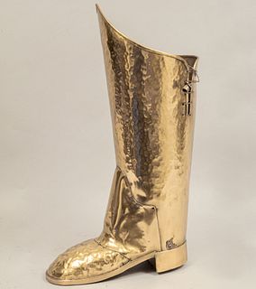 Umbrella stand. 20th century. Boot-like design. Made in gilded, hammered and molded brass.