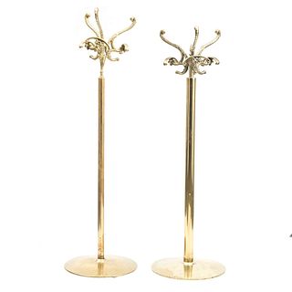 Lot of four coat racks. 20th century. For dining room service. Made in golden brass. With smooth cylindrical shafts.