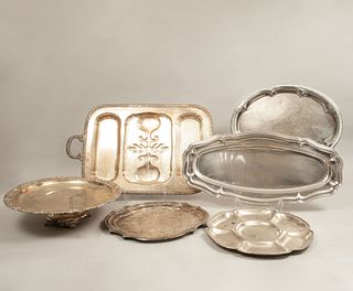 Lot of 6 service trays. Twentieth century. Made of silver metal. Different designs. Decorated with organic motifs.