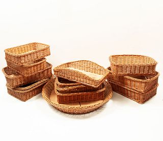 Lot of 13 bread baskets. 20th century. Made of woven wicker with wooden bases. Openwork designs.