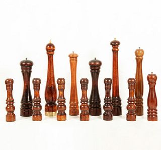Lot of 13 pepper shakers. Twentieth century. Different designs. Made of turned and carved wood. Decorated with ringed elements.
