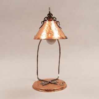 Desk lamp. Twentieth century. Made of bronze. Electrified for a light. Decorated with organic elements.