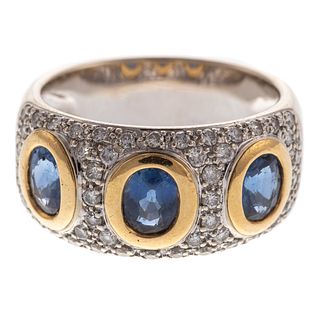 An 18K Oval Sapphire Ring with Pave Diamonds