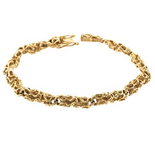 A Free Form Link Bracelet in 14K Yellow Gold