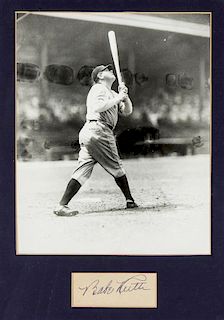 (BASEBALL) RUTH, BABE. Clippped sinature ("Babe Ruth"), n.d. Framed with black and white photograph.