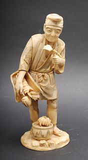 Japanese Carved Bone "Man with Plants" Sculpture