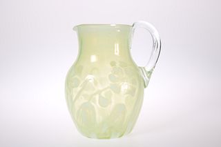 A LATE VICTORIAN VASELINE GLASS PITCHER
 Of balus