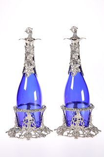 A PAIR OF SILVER-PLATE MOUNTED BLUE-GLASS DECANTE