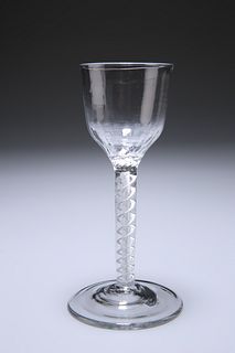 AN AIR TWIST WINE GLASS
 Circa 1760
 With fluted 