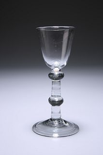 A BALUSTROID WINE GLASS
 Circa 1750
 With round f