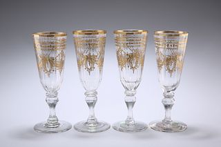 A SET OF FOUR BOHEMIAN GILDED WINE GLASSES, CIRCA