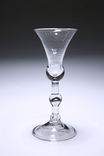A LIGHT BALUSTER WINE GLASS
 Circa 1730
 With bel