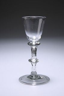 A BALUSTROID WINE GLASS
 Circa 1740
 With round f