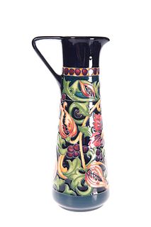 A MOORCROFT POTTERY TRIAL JUG
 Of tapering cylind