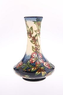 A MOORCROFT POTTERY VASE
 With squat body and tru