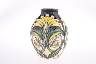 A MOORCROFT POTTERY VASE
 Tubelined and hand-pain