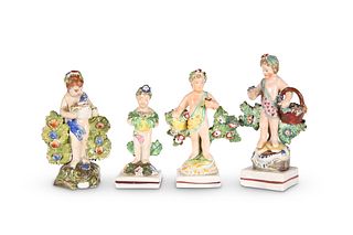 A GROUP OF FOUR PEARLWARE FIGURAL TABLE ORNAMENTS