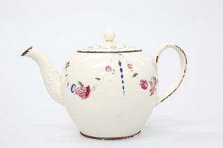 A LATE 18TH CENTURY CREAMWARE TEAPOT AND COVER
 O