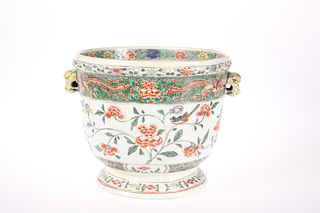 A CHINESE FAMILLE VERTE PLANTER, circular with ma